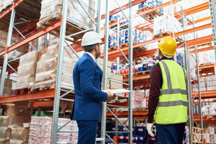 workers-in-warehouse-T4XFYL