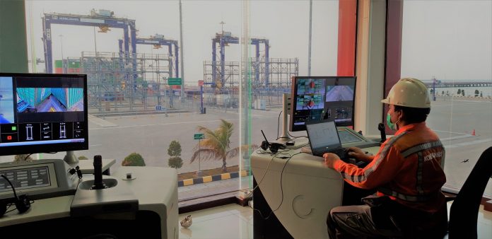 Calibrating one of the remote operating desks at KTMT, Indonesia Konecranes
